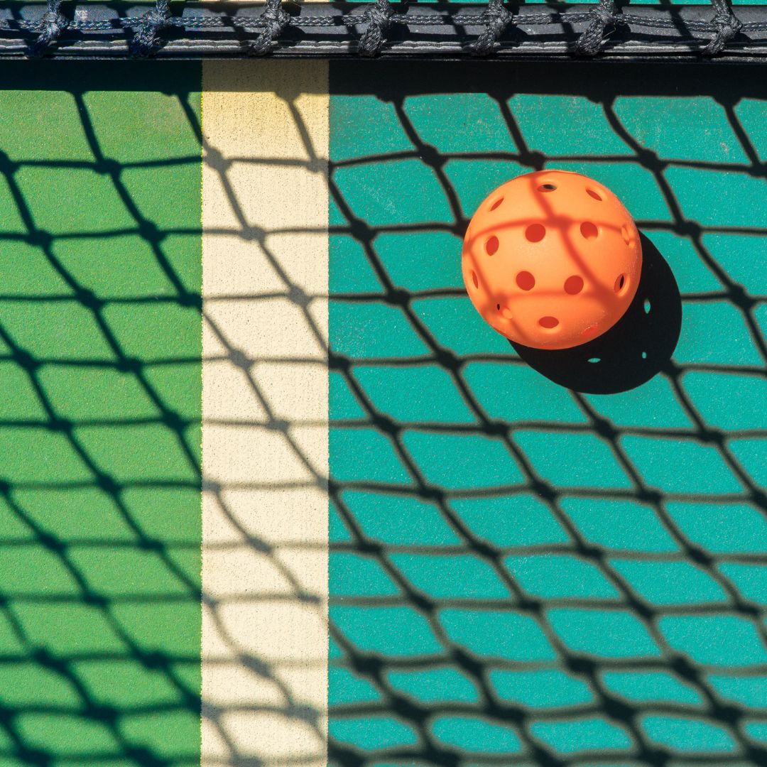 Image of a pickleball court installed on a tennis court