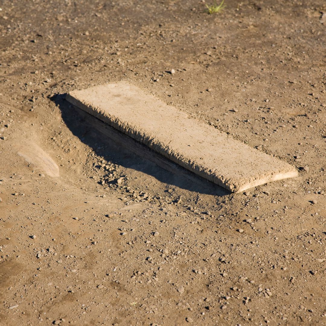 image of a pitchers mound on a ball field that needs maintenance