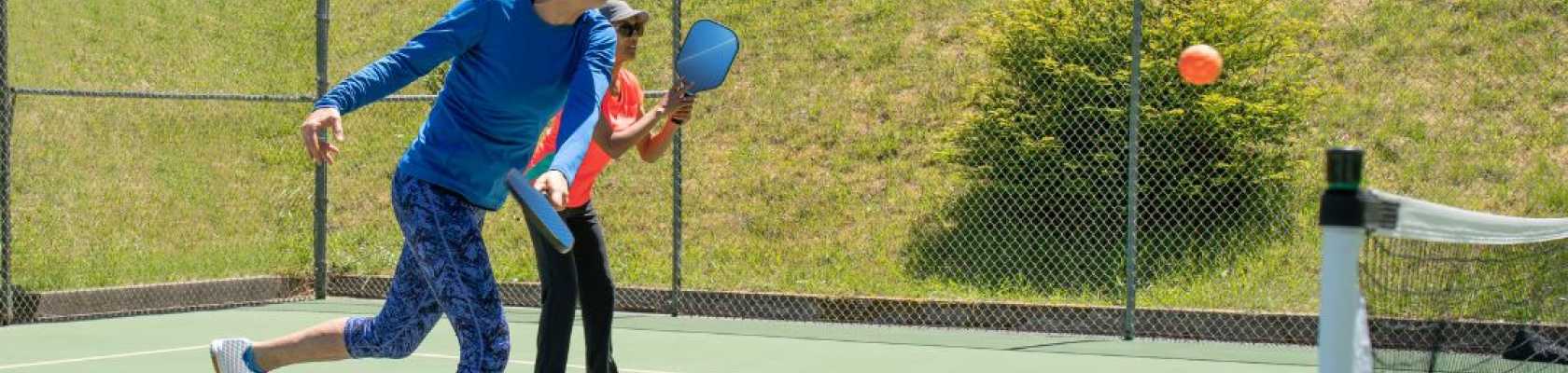 Image if people playing on a pickleball court court installation