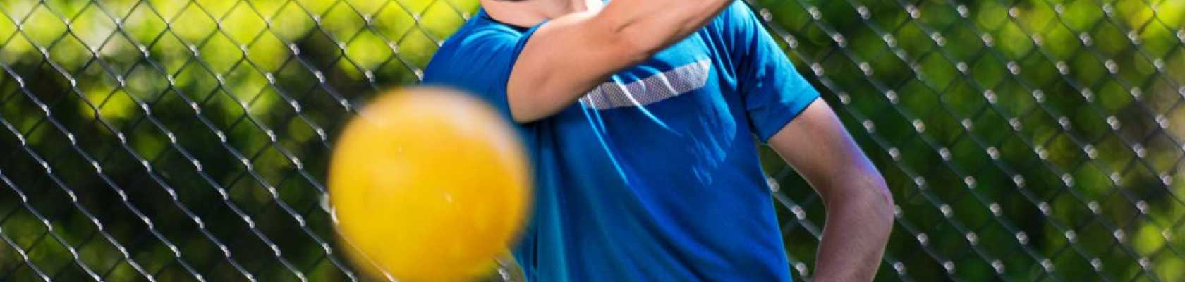 Images of someone playing on a pickleball court