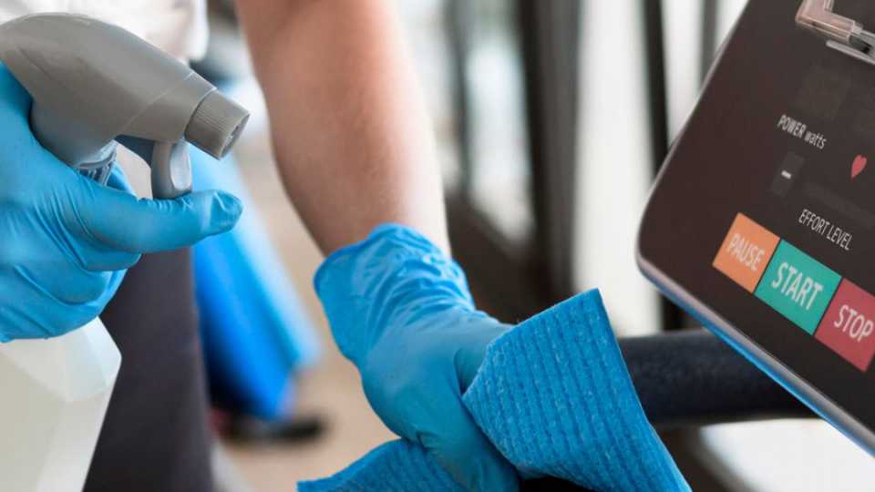 Image of gym equipment getting cleaned