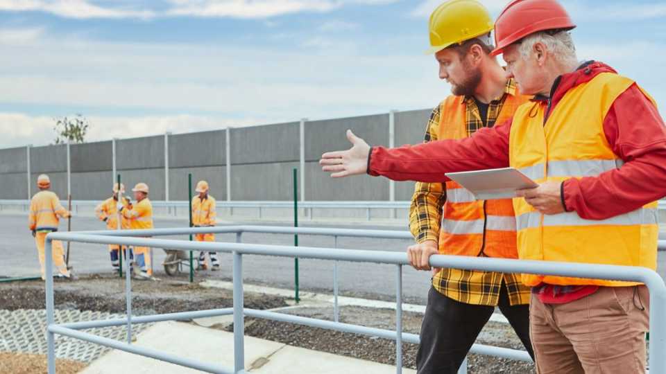 Image of park maintenance manager motivating an employee on the job