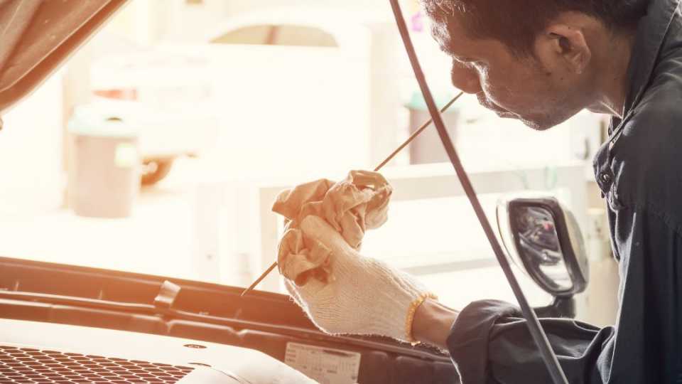 Image of a maintenance employee completing a vehicle inspection