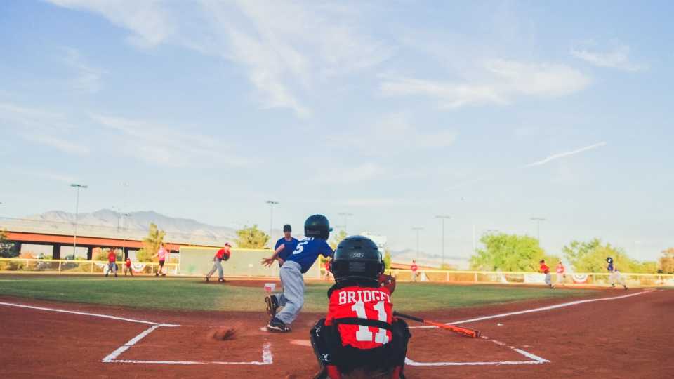 Image of kids playing on maintained baseball field